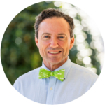 Dr. Buddy Davis smiling wearing a bowtie